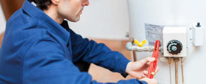 plumber repairing a water heater