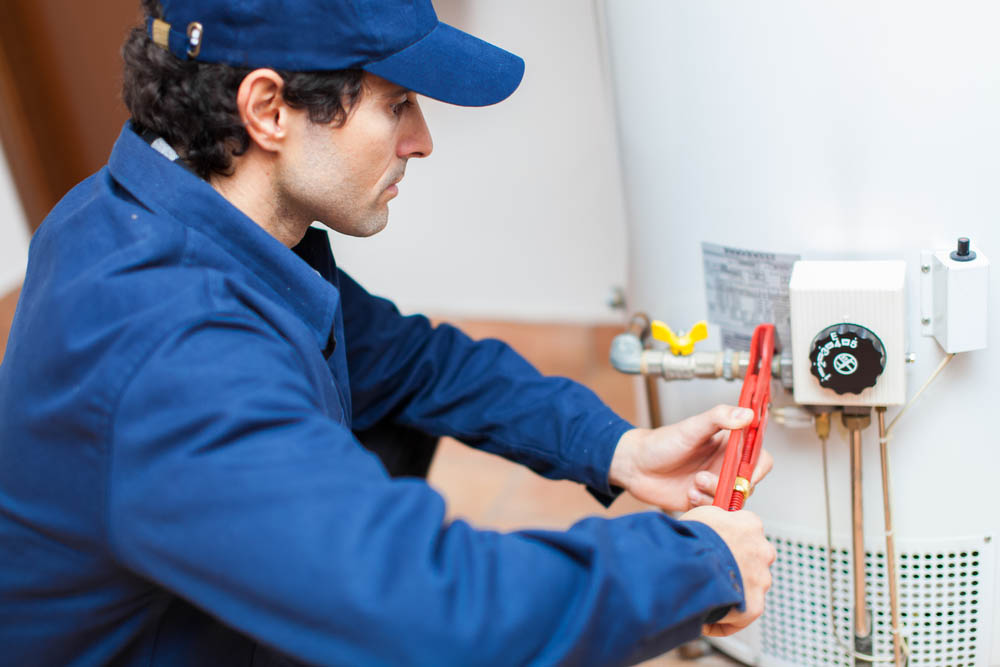 plumber repairing a water heater
