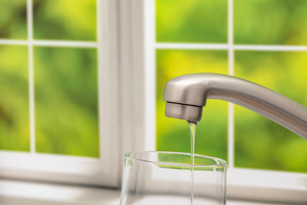 low-pressure water from an open kitchen faucet